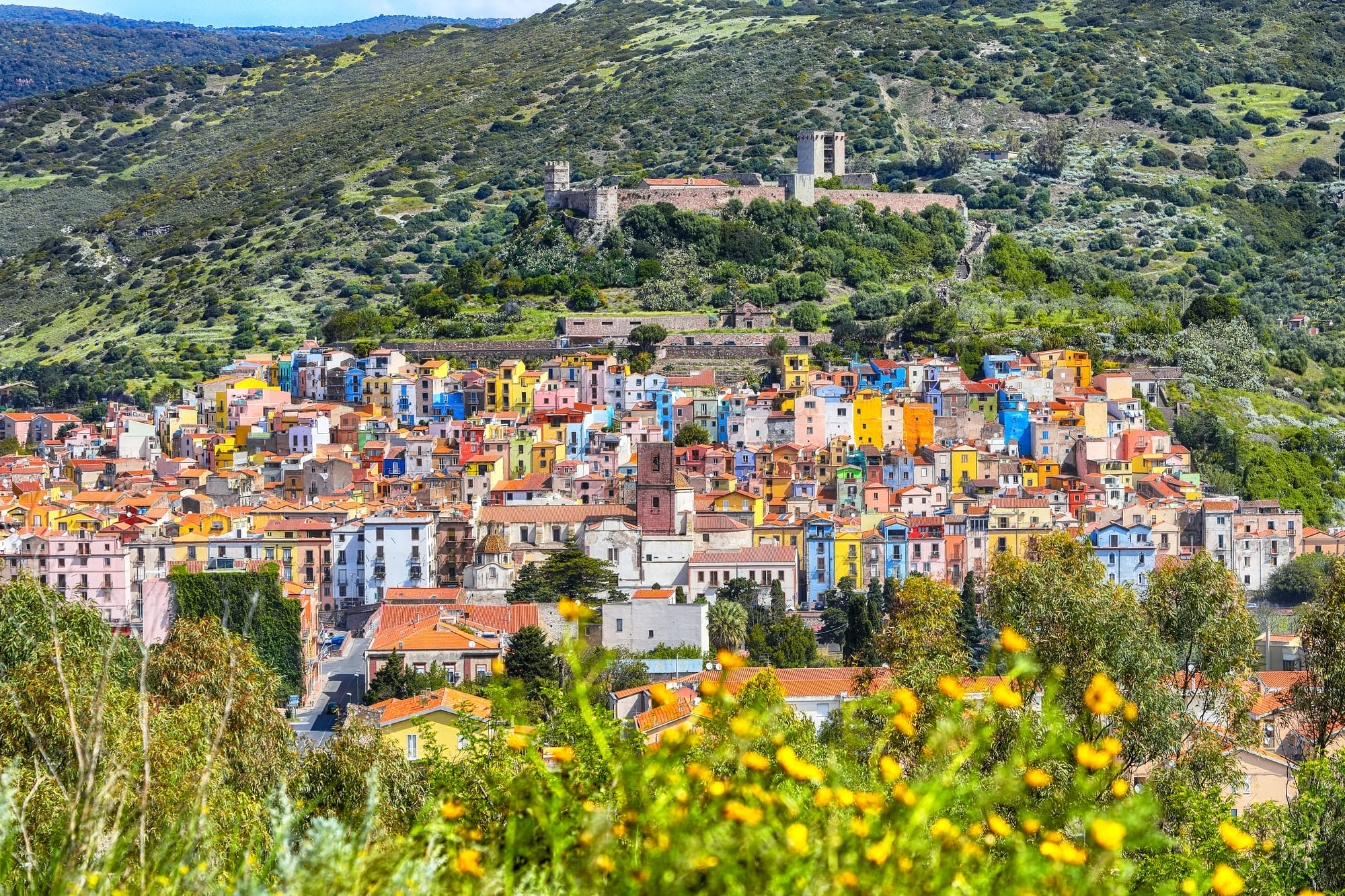 Wonderful morning panorama of colourful houses of old town Bosa in Sardinia